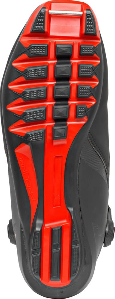 Red and black high-performance winter ski boot sole with rugged grip for maximum traction in snow. Designed for durability and comfort during winter sports activities. Perfect for icy terrains and snowy trails.