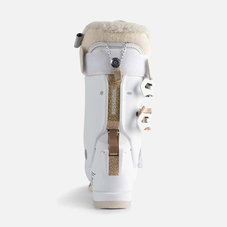 White ski boot with beige fur lining for winter sports and skiing.