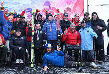 Celebrating winter sports and adaptive skiing with a diverse group of para-athletes and supporters at a winter competition, showcasing resilience and the joy of winter sports.