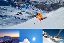 Sunny winter ski slope with skier in orange gear racing down mountain, snow-covered landscape with ski resort in background.