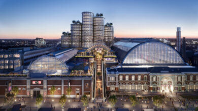 Elegant winter cityscape featuring a modern glass-roofed shopping centre with illuminated exteriors, showcasing contemporary architecture and vibrant urban life, ideal for winter trips and holiday shopping.