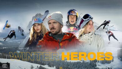 Brilliant winter sports heroes dressed in gear amidst snowy mountain landscape, celebrating winter adventure.