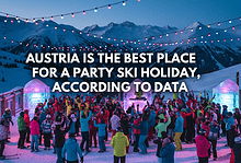 A vibrant outdoor ski holiday scene in Austria with colourful string lights, snow-covered mountains, and a lively crowd enjoying the party atmosphere during a winter ski holiday.