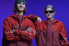 Two models wearing Oakley winter apparel and sunglasses, showcasing the latest official sponsorship gear for winter sports enthusiasts.