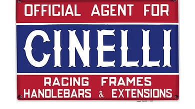 Vintage-style sign indicating official agent for Cinelli racing frames, handlebars, and extensions.