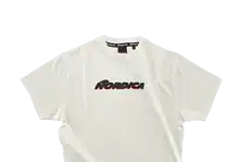 White Nordica branded T-shirt designed for winter sports enthusiasts, featuring bold black and red logo on the front, ideal for winter activities and casual wear.