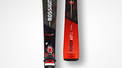 Rossignol Forza 60 skis with bindings designed for winter skiing enthusiasts, featuring a sleek black and red design for optimal performance on snow.