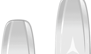 Pair of Atomic Vantage 97 Ti skis in white and black with dynamic design, ideal for all-mountain skiing and winter sports enthusiasts.