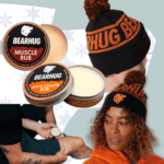 Bearhug Muscle Rub and Anti-Chafe Rub tins with a beanie and winter apparel on a cool, patterned background, showcasing Bearhug skincare for winter athletes.