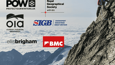 Climber on a snowy mountain cliff representing winter safety and emergency briefing for climate and nature crisis.