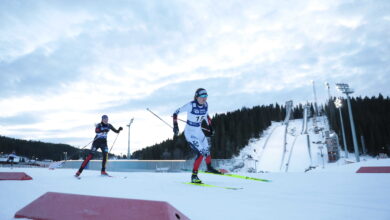 Cross-country skiers racing on a snowy Nordic course