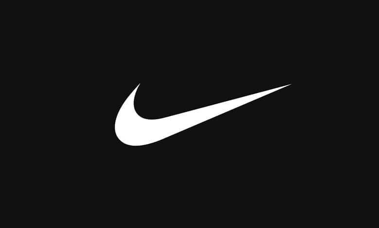 Close-up of the Nike swoosh logo in white on a black background, representing sportswear and athletic apparel.