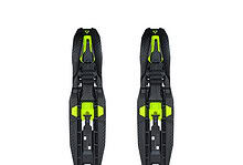 Pair of black and neon green ski bindings designed for winter sports enthusiasts, featuring adjustable straps and durable construction for optimal performance on snow.