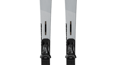 Pair of Salomon skis designed for winter skiing, featuring a sleek grey design with black bindings, ideal for winter sports enthusiasts.
