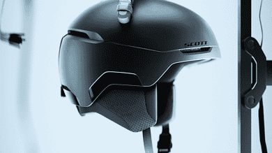 High-tech winter sports helmet with integrated communication system, designed for skiing and snowboarding enthusiasts, featuring a sleek black finish and secure fit.