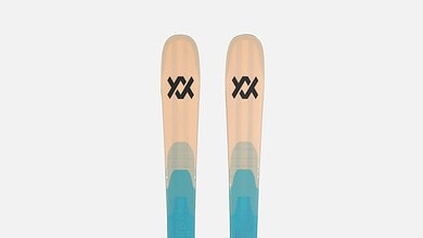 Pair of Volkl skis with blue and beige design, ideal for winter sports and skiing adventures.