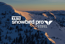 Snowy mountain landscape at dawn with YETI Snowbird Pro by STIFEL logo overlay, winter skiing scenery.